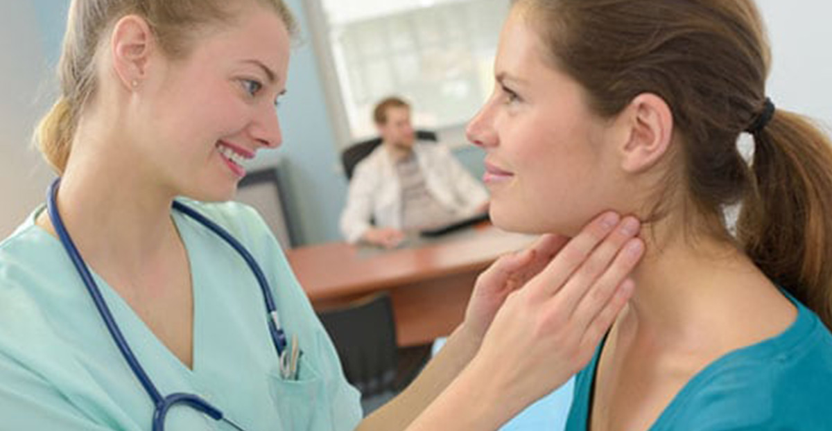 Doctor-checking-patient-for-thyroid-disorder