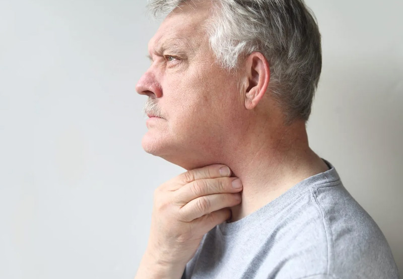 Man-suffering-from-throat-cancer